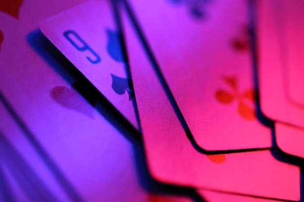 Live dealer dealing cards at Caribbean Stud Poker table